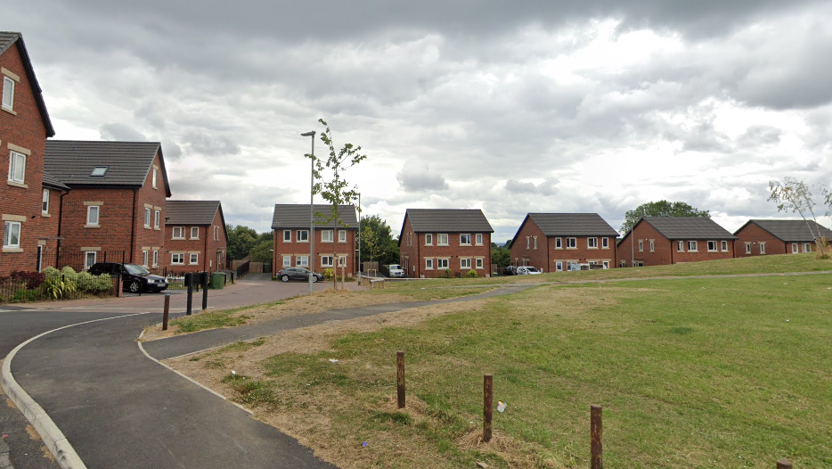 Monet Close in Chapel Allerton, a modern housing estate with green open space in the centre.