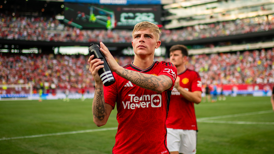 Manchester United's Brandon Williams applauds fans after a pre-season friendly against Arsenal in 2023