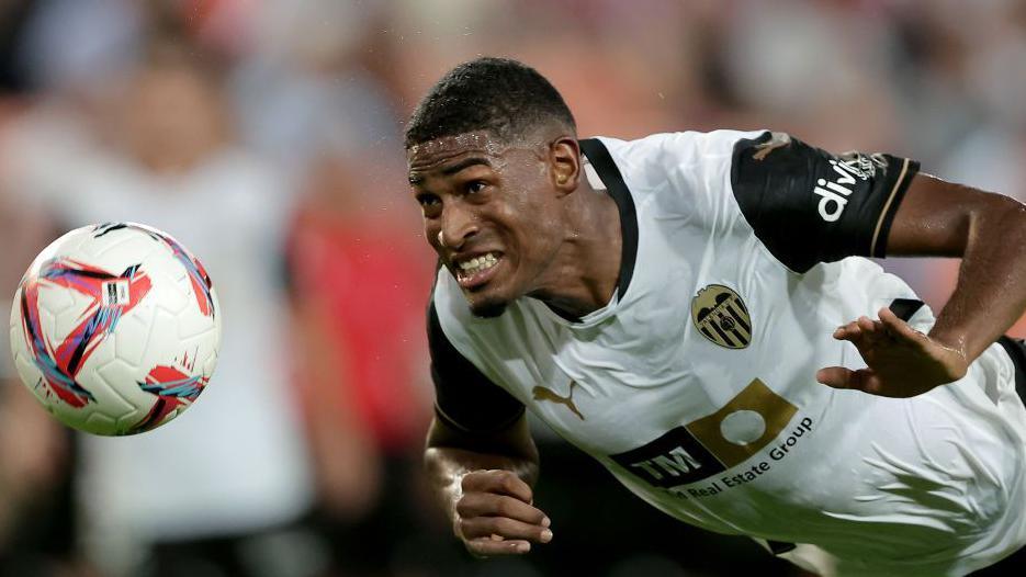 Valencia centre back Cristhian Mosquera heading a ball
