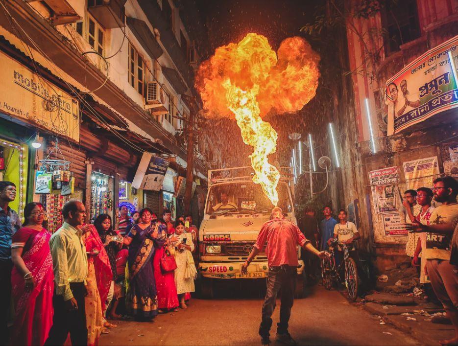 This picture by Ankit Ghosh, who is 16, shows a crowd at the festival of Vijaya Dasami in India, watching a fire-breathing trick. 
