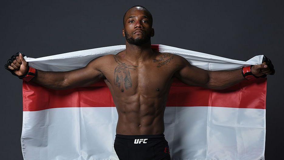 Leon Edwards poses with an England flag