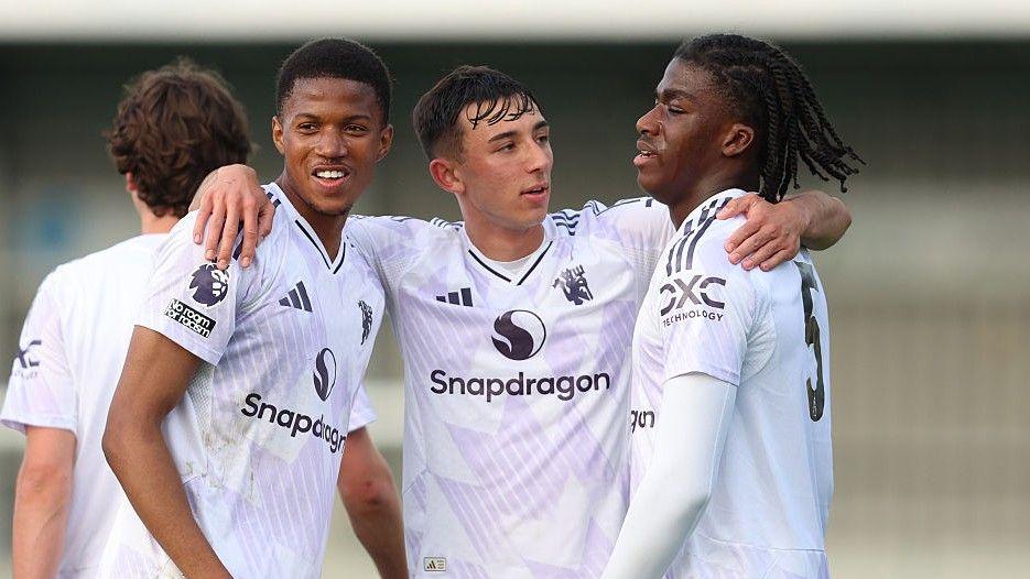 Chido Obi (left), Sonny Aljofree and Godwill Kukonki (right) celebrate Manchester United's win