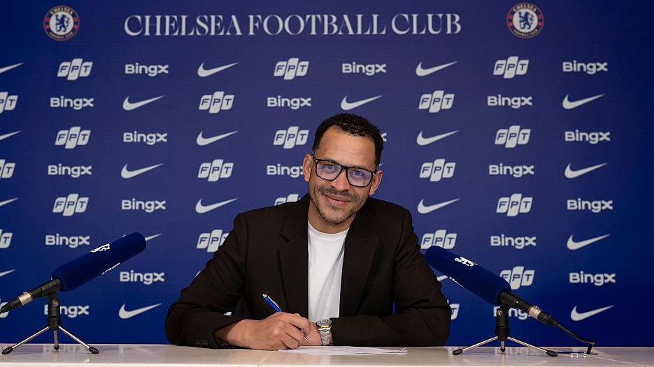 Liam Rosenior signing a contract at Chelsea