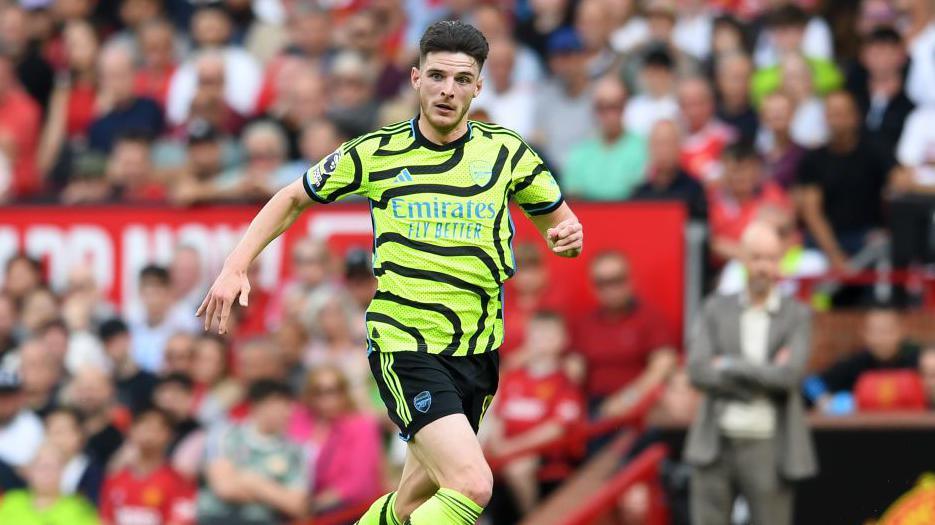 Declan Rice running with the ball for Arsenal