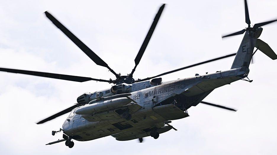 A US Marine Sikorsky CH-53K King Stallion helicopter flies at José Aponte de la Torre Airport in Puerto Rico where forces train to support operations in the Caribbean