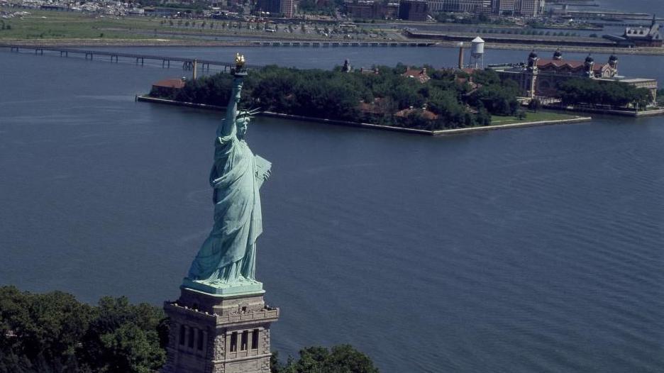 Aerial photograph of New York Harbour, with the Statue of Liberty in close proximity to Ellis Island