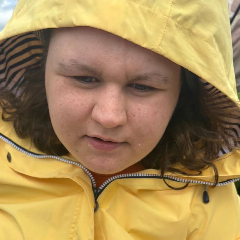 picture of amber wearing a yellow rain jacket and hood