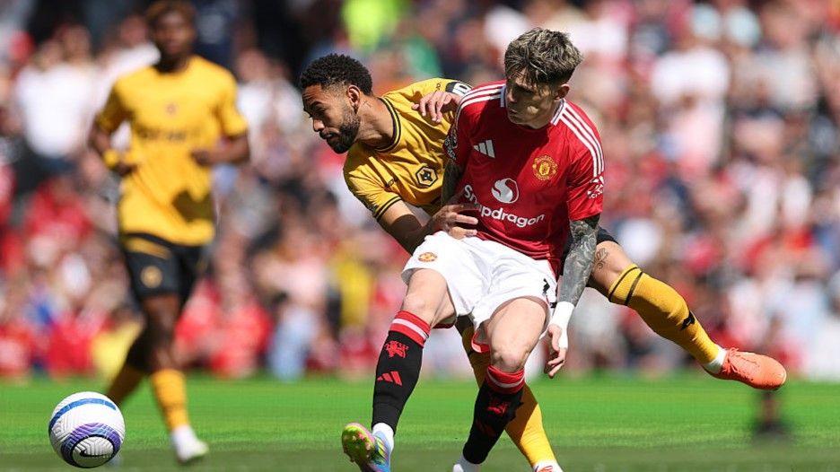 Manchester United forward Alejandro Garnacho and Wolves' Matheus Cunha tussle for possession in the Premier League game at Old Trafford