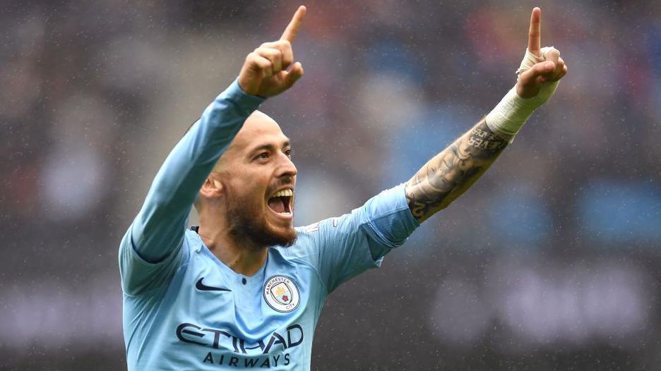 David Silva of Manchester City celebrates after scoring his team's fourth goal during the Premier League match between Manchester City and Huddersfield Town at Etihad Stadium on August 19, 2018 