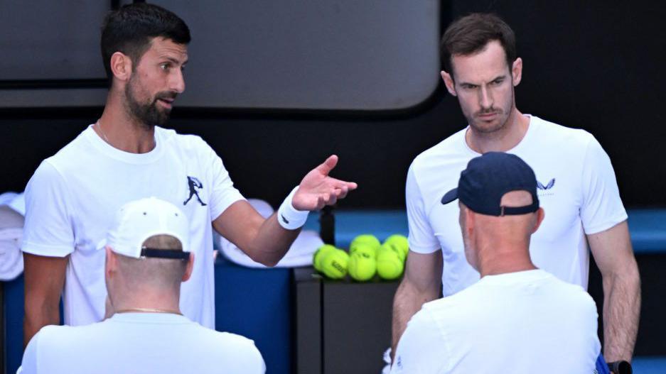 Novak Djokovic and Andy Murray in discussion court-side