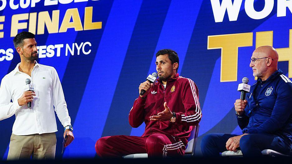 Novak Djokovic and Rodri speaking on stage at Fanatics Fest before the 2026 World Cup final