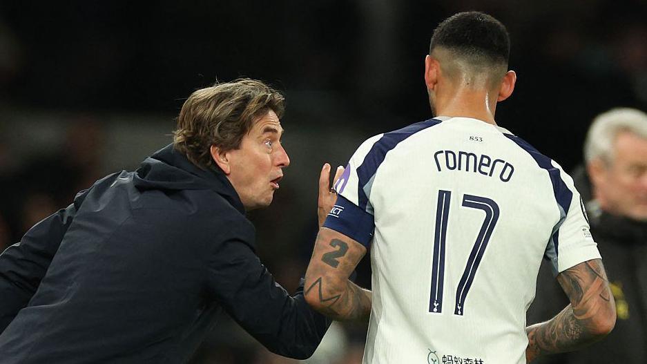 Former Tottenham boss Thomas Frank and captain Cristian Romero