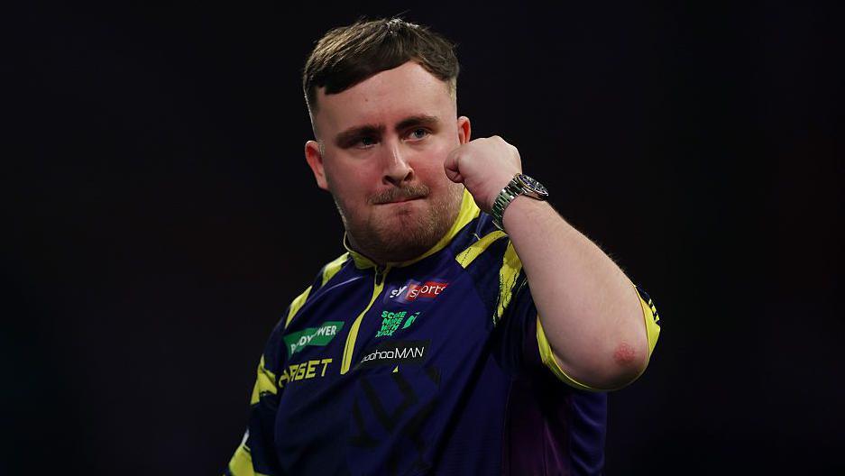 Luke Littler celebrates at the World Darts Championship