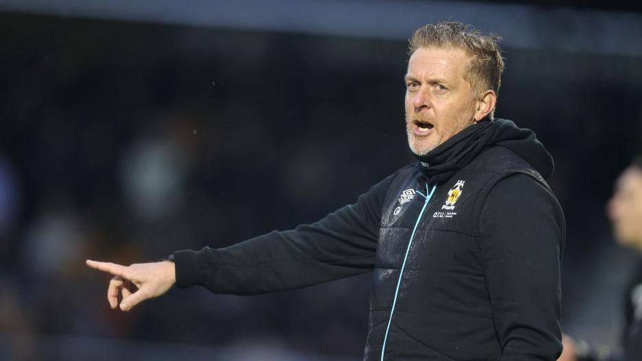 Cambridge United boss Garry Monk points from the touchline