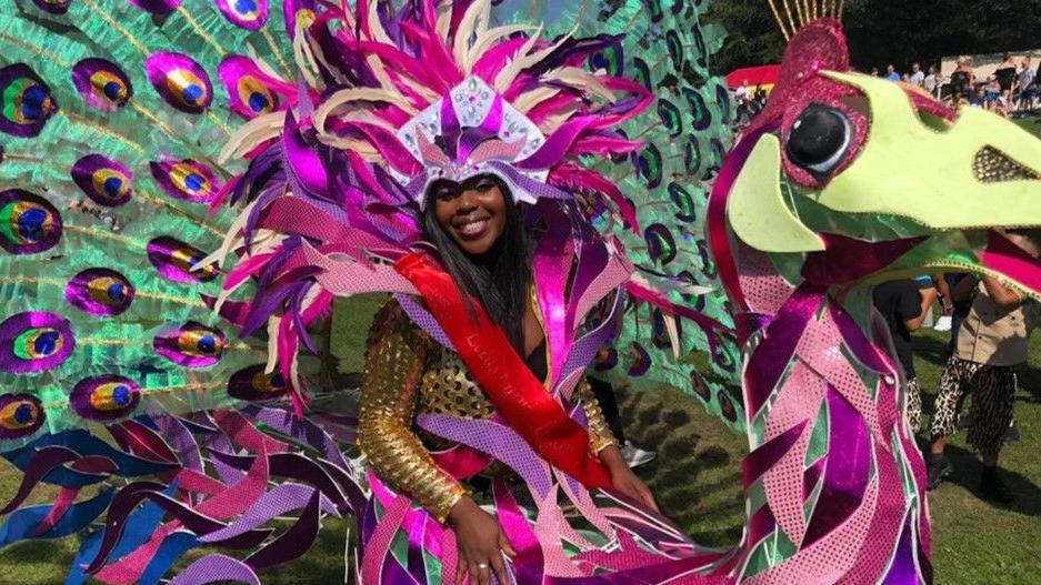 Woman in colourful costume pictured at 2019 Carnival in Leeds