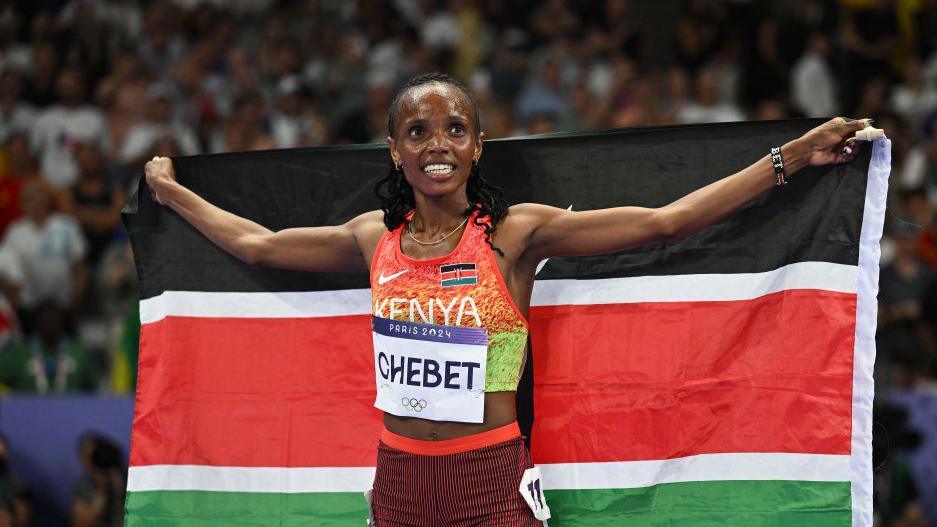 Beatrice Chebet celebrates winning 5,000m gold at the Paris Olympics