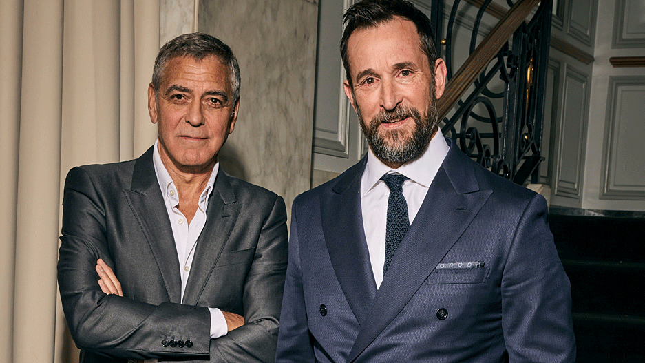 George Clooney and Noah Wyle - both in suits looking at the camera.