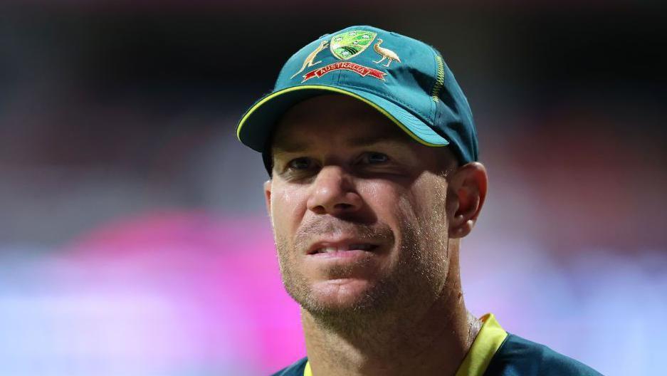 David Warner wearing an Australia cap