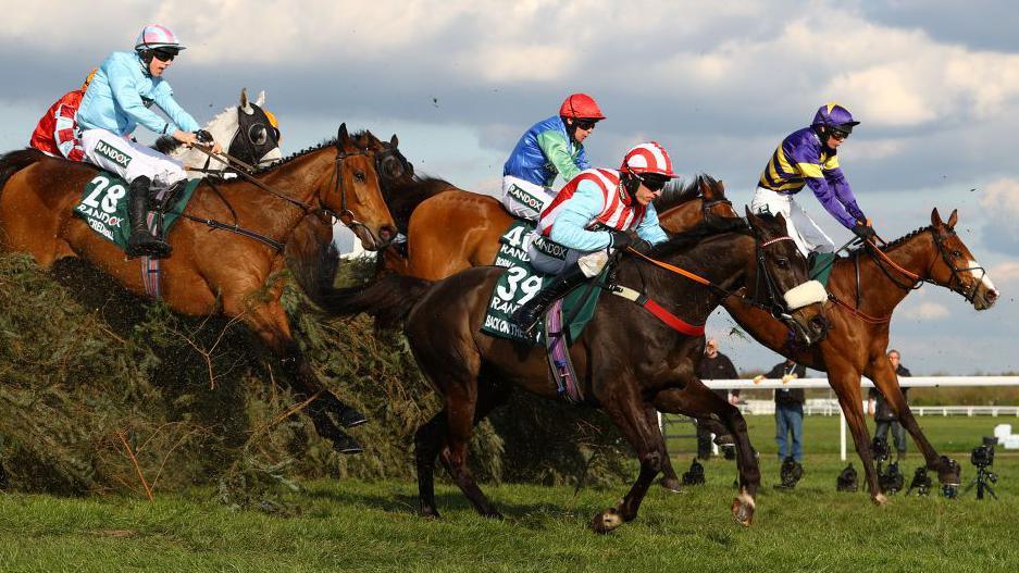 Corach Rambler and others jumping The Chair at the Grand National in 2023