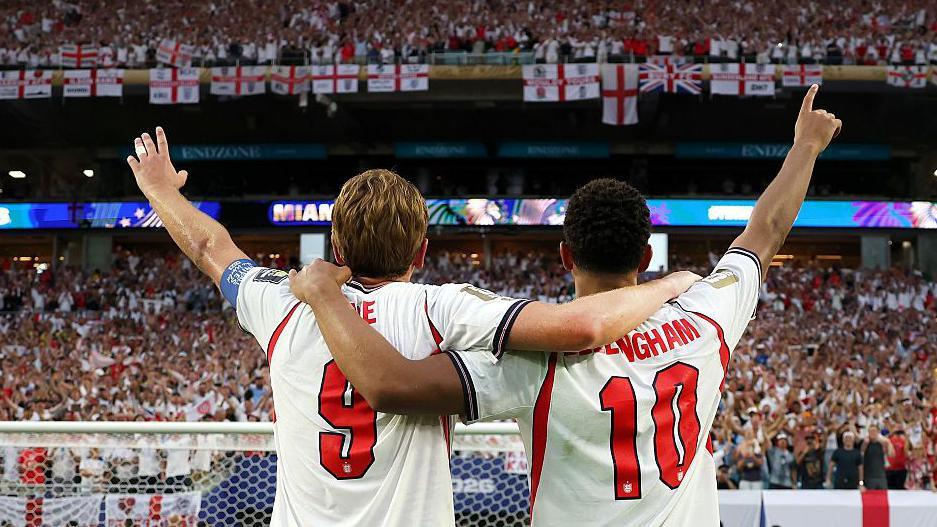 Jude Bellingham and Harry Kane of England salute the fans after the 2-1 victory over Norway