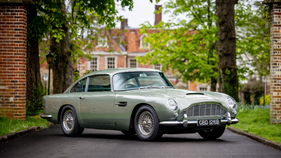 Sage green Aston Martin DB5 outside Cliveden House