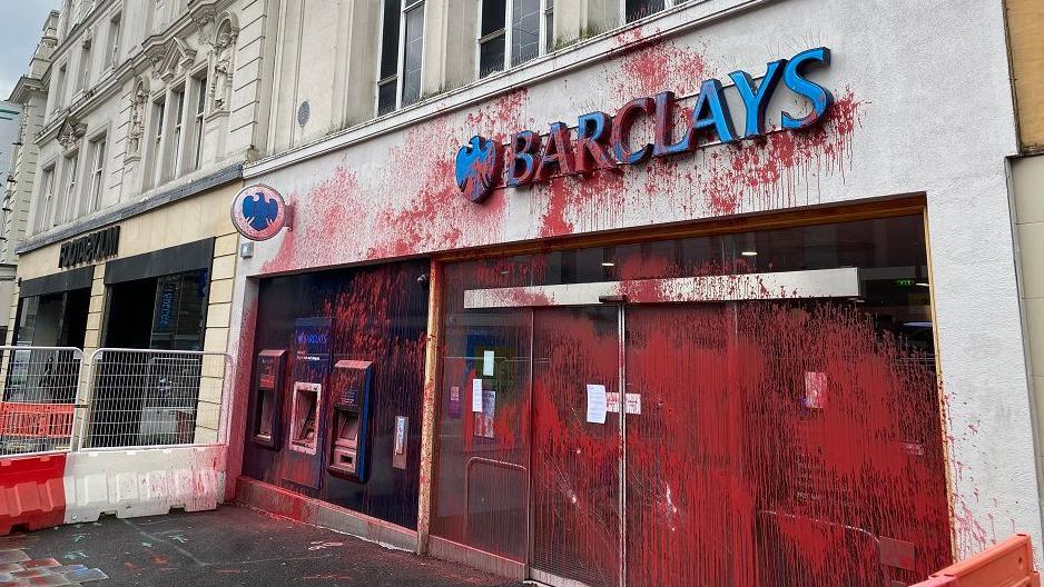 Red paint splashed all over the front of a Barclays bank on Northumberland Street in Newcastle.