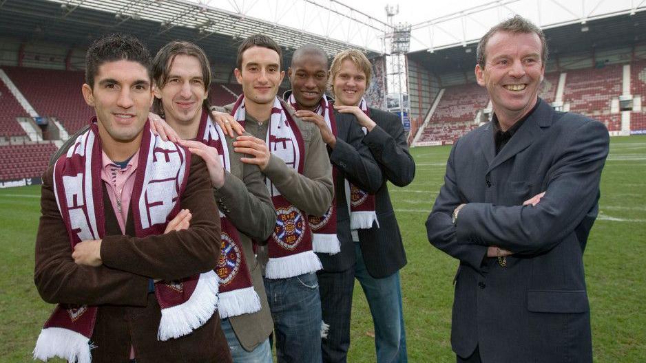 Graham Rix (right) poses with some of the January signings he knew nothing about