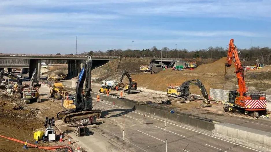 Construction work taking place on the M25 in Surrey. Pictured are bulldozers and other heavy machinery   