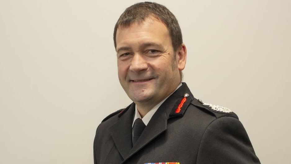 A head and shoulder picture of Gavin Tomlinson in his firefighter's formal uniform 