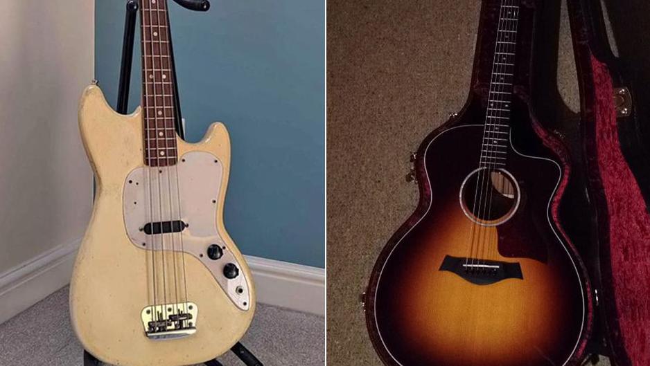 View of two guitars. The one on the right is a beige-coloured bass guitar on a stand, the one on the left is a brown acoustic guitar in an open case with red velvet lining