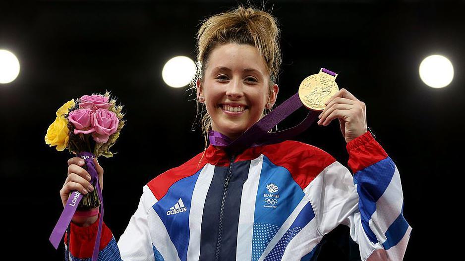 Jade Jones celebrates with an Olympic gold medal