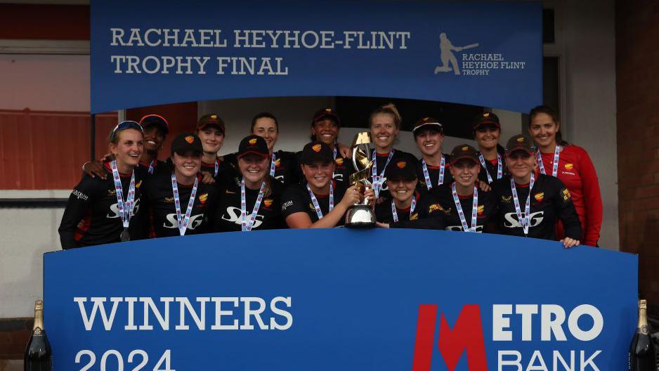 Sunrisers celebrate winning the Rachael Heyhoe Flint Trophy