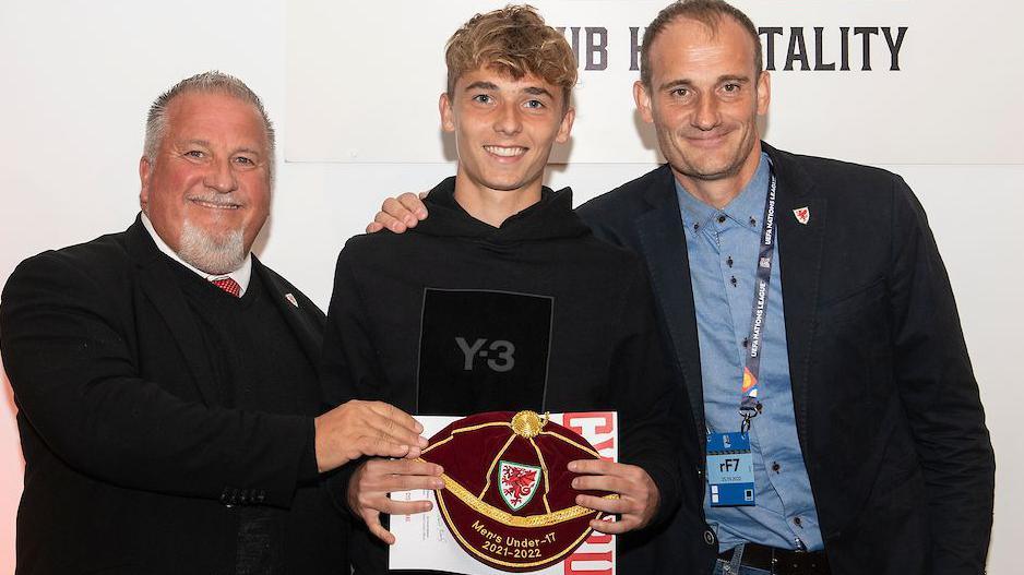 Callum Osmand (C) receives a cap during the league A 2022 Nations League fixture between Wales & Poland at the Cardiff City Stadium, Cardiff, Wales on  25 September 2022