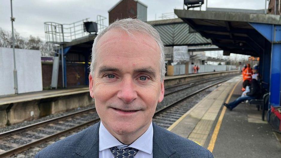 Translink's chief executive Chris Conway at a railway station