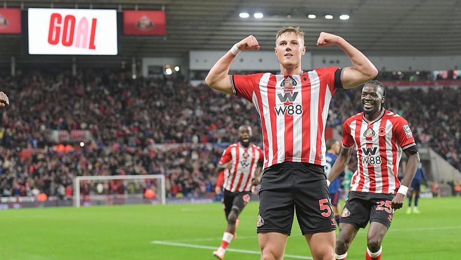 Dan Ballard celebrates scoring against Arsenal