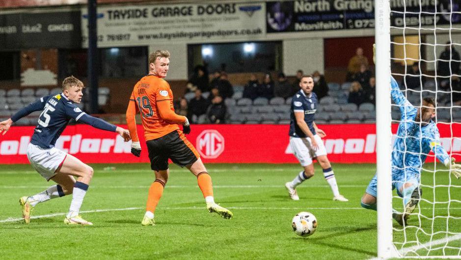 Dundee United's Sam Dalby (second left) scores the winner against Dundee