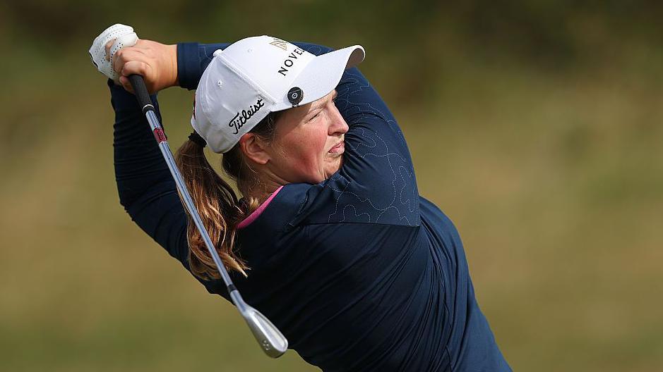 Lottie Woad takes a shot at Royal Porthcawl