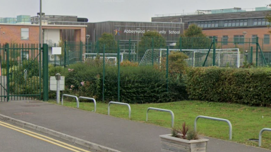 An image of Abbeywood Community School from a road outside. 