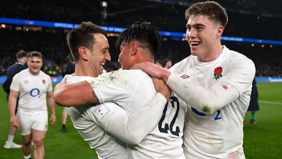 Alex Mitchell [left], Marcus Smith [centre] and Tommy Freeman [right] celebrate following England's win over Ireland in the 2024 Six Nations 