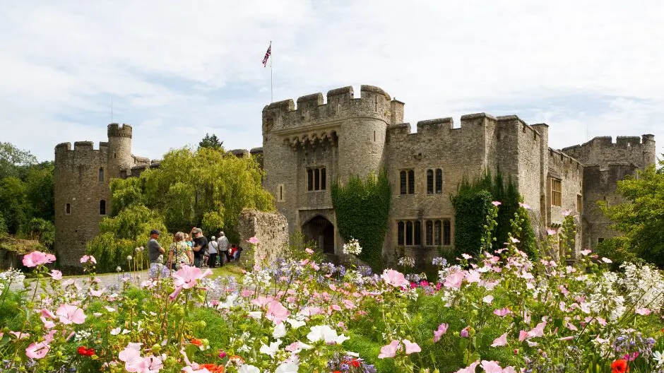 Allington Castle with colourful flowers in the foreground.