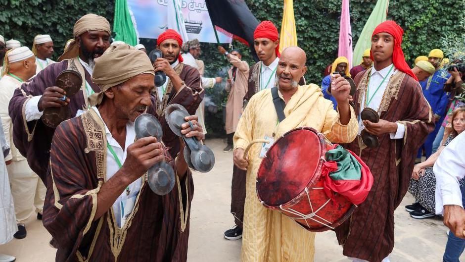 An image of men dancing and playing instruments to celebrate Prophet Muhammad's birthday in Tunis, Tunisa - Sunday 15 September 2024.