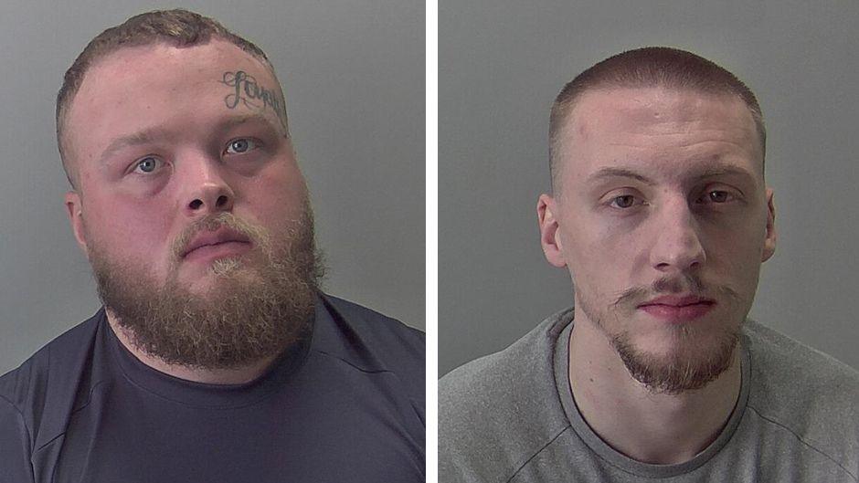 Two police mugshots of men staring at the camera. The man on the left has brown hair and a reddish beard and is wearing a blue T-shirt. The man on the right has a shaved brown hair and a goatee and is wearing a grey sweatshirt.Both are looking into the camera.