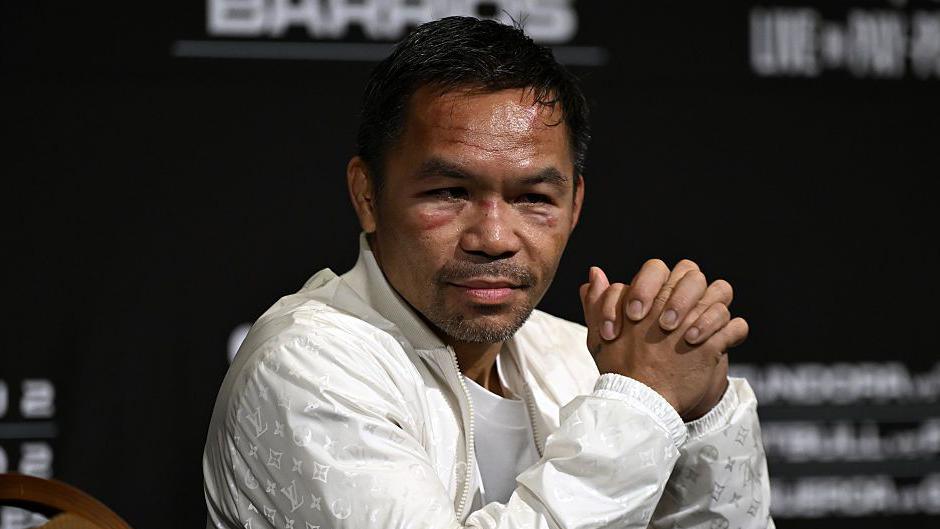 Manny Pacquiao bruised and batter in his post-fight news conference
