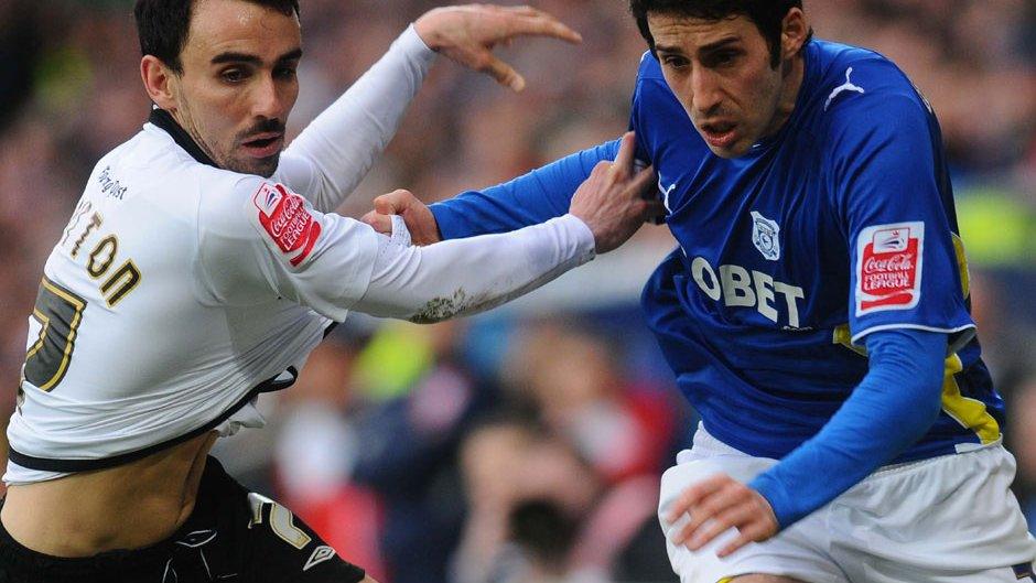 Leon Britton and Peter Whittingham tangle during the last match between Cardiff and Swansea
