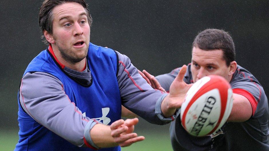 Ryan Jones evades the tackle of Ian Evans in a Wales training session