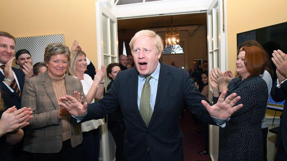 Boris Johnson is greeted by staff