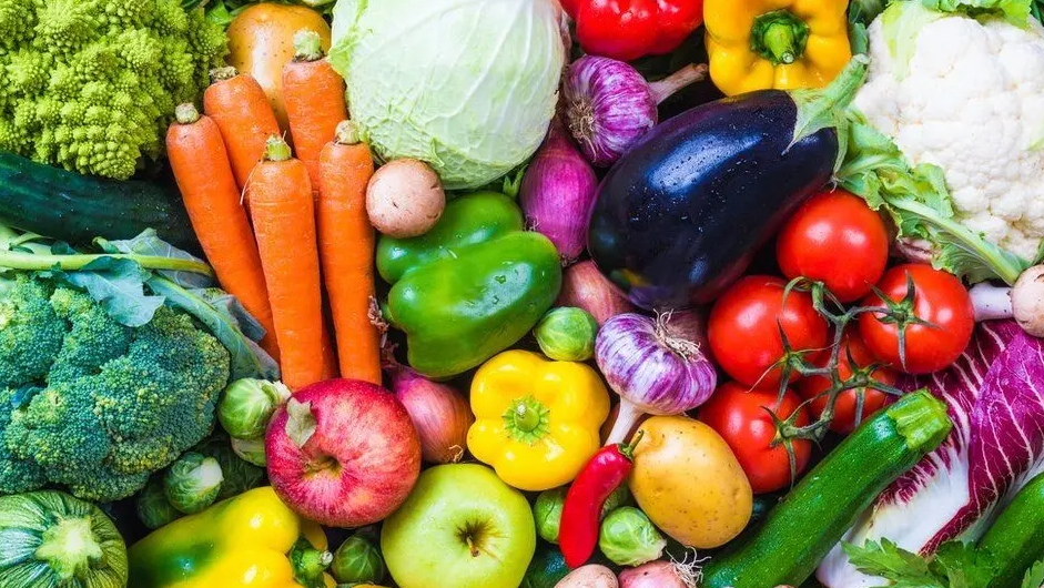 Vegetables are laid out together ranging from carrots, peppers, courgette and aubergine.