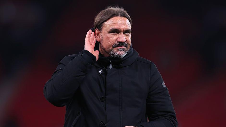 Daniel Farke gestures to supporters
