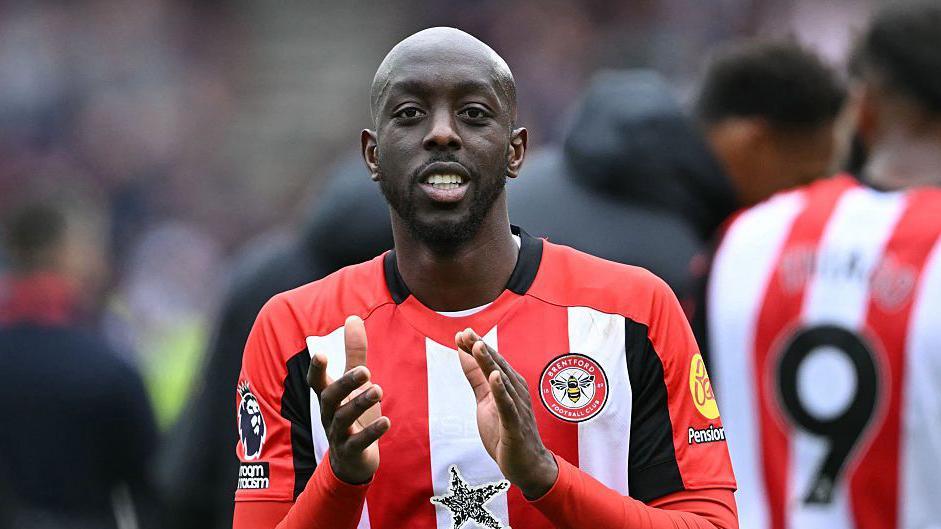 Yoane Wissa applauding in a Brentford kit