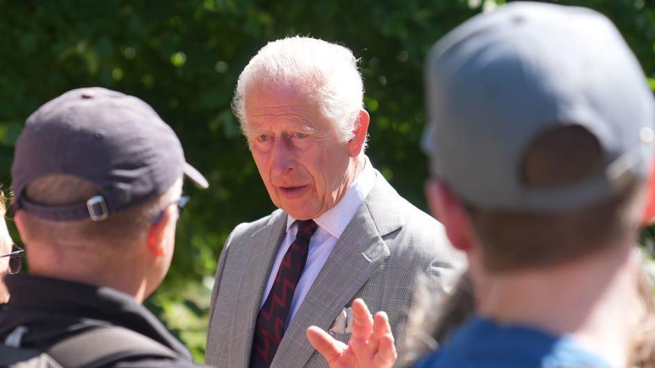 King Charles speaking to members of the public. 